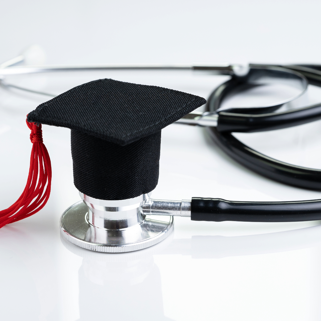 stock photo of stethoscope with graduation cap