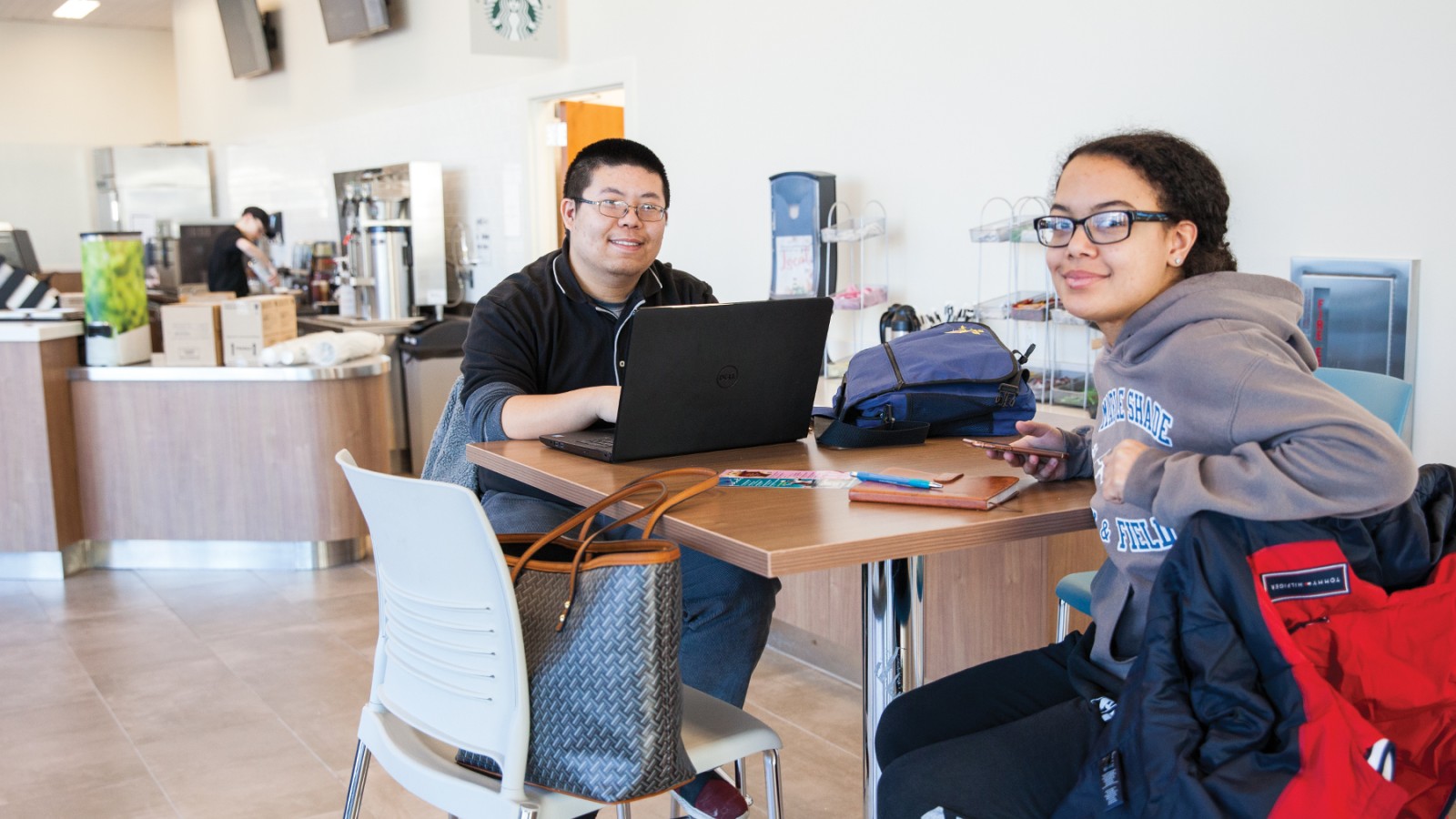 Two students in at a table in the Student Success Center